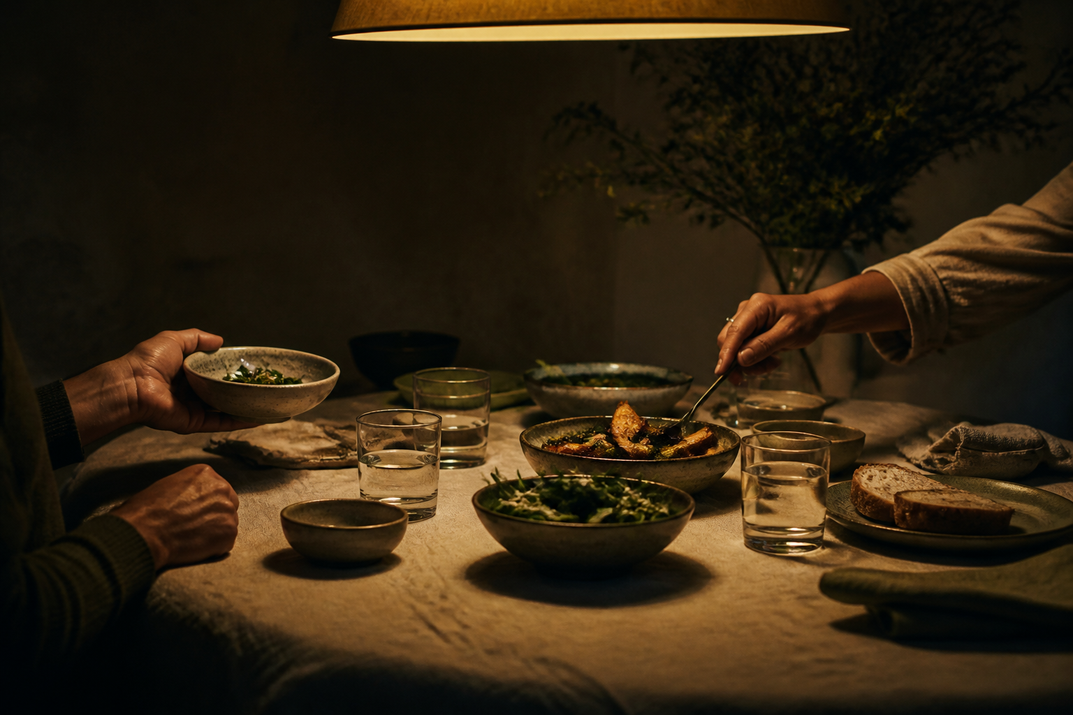 Two people sharing a nourishing meal around a warmly lit table